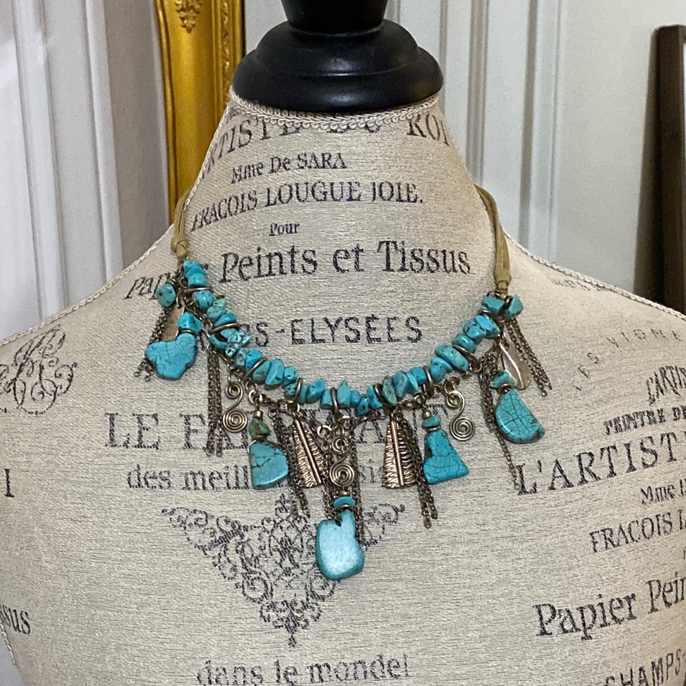 Turquoise and silver toned necklace.